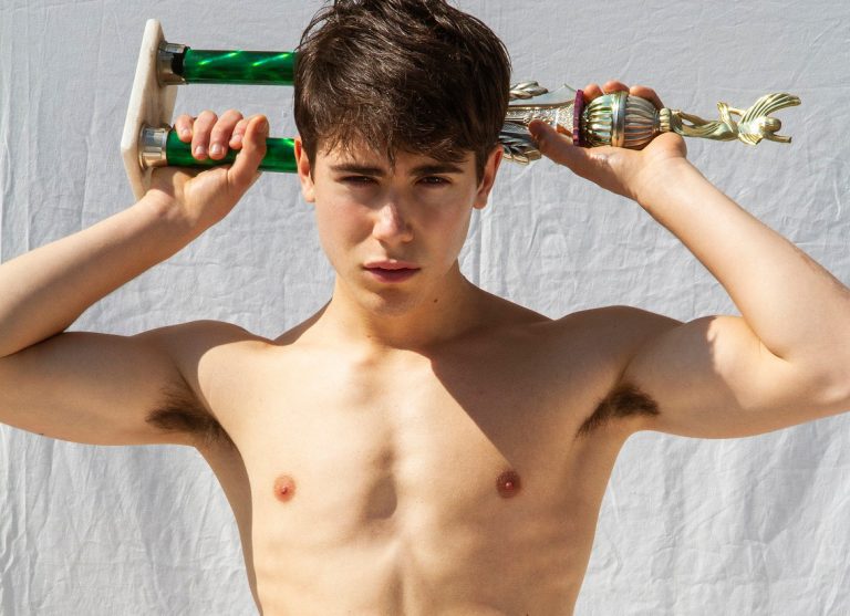 Shirtless boy holding sports trophy - Muscular male model HEYBOY