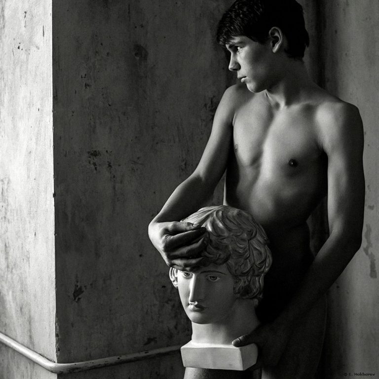 Nude Male Holding Marble Sculpture - Photograph by Evgeny Mokhorev - BW