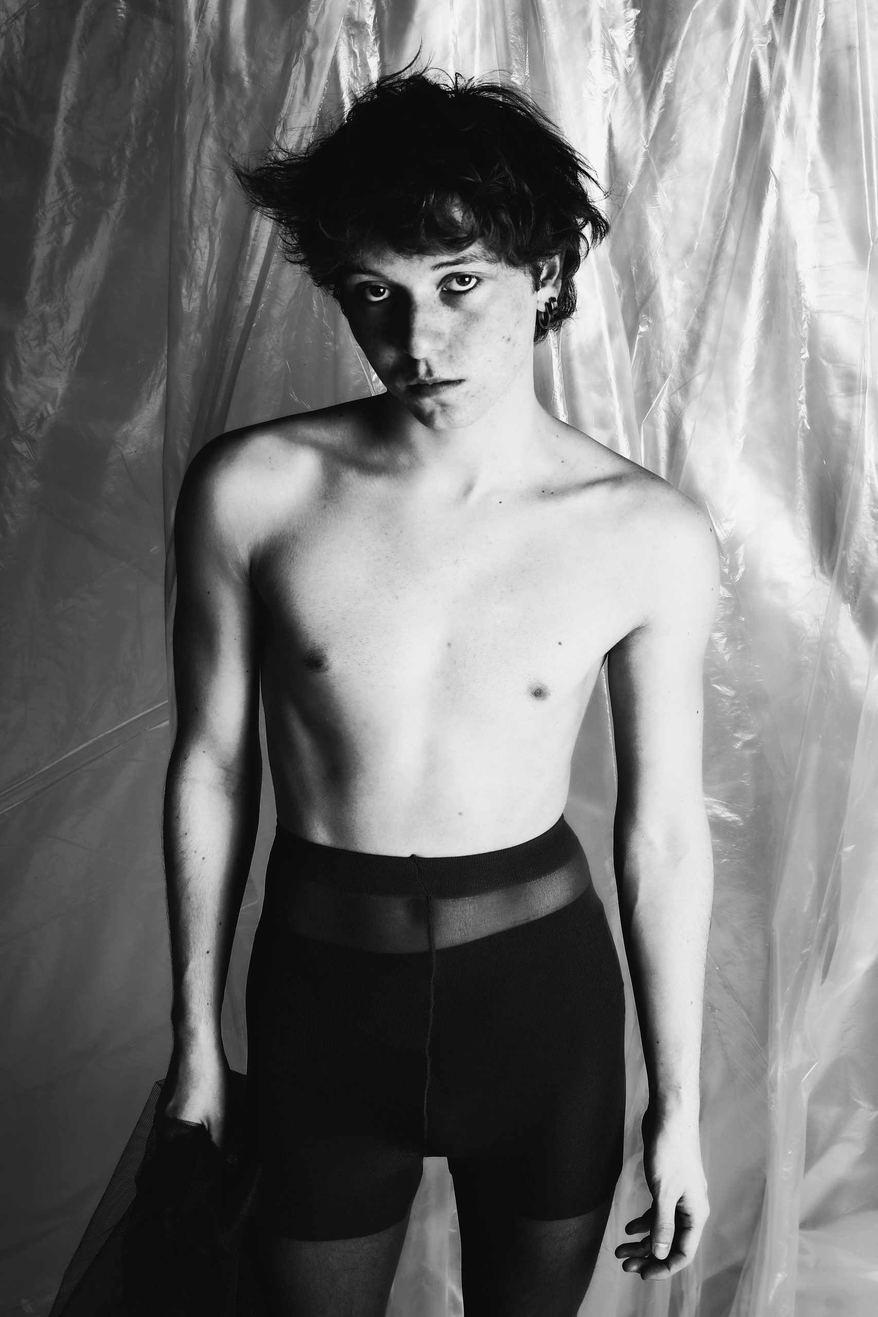 Minimal black and white studio portraits focusing on posture, texture, and the male form against simple backdrops — BLUEBOY, HeyBoy Fanzine