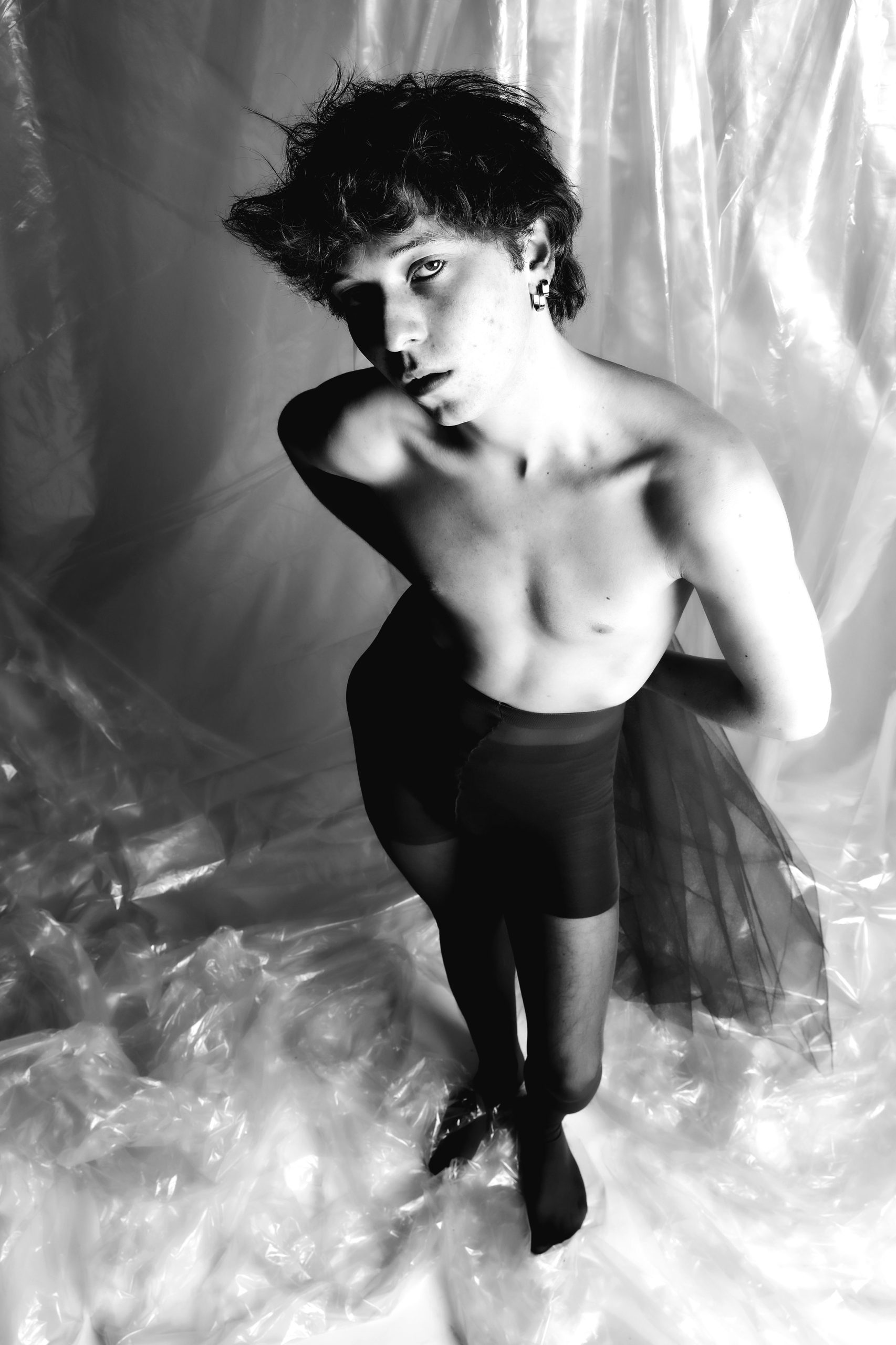 Minimal black and white studio portraits focusing on posture, texture, and the male form against simple backdrops — BLUEBOY, HeyBoy Fanzine