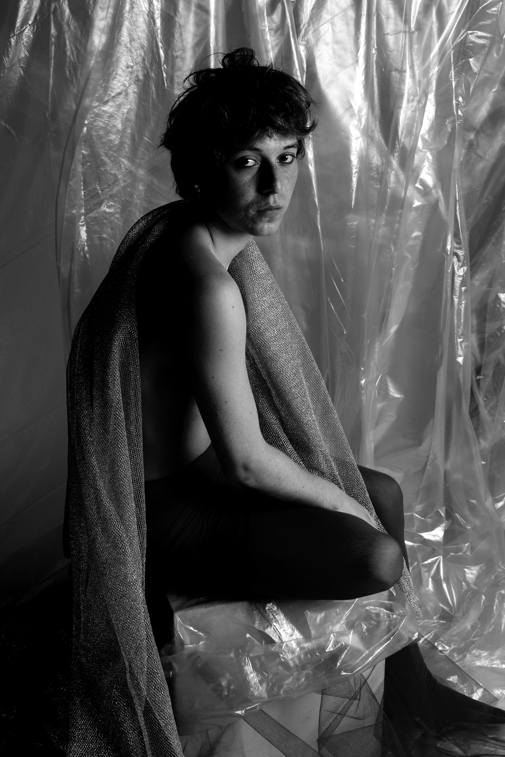 BLUEBOY — color studio portraits of a male figure posed against plastic and fabric, using soft light, blue tones, and minimal styling. HeyBoy Fanzine