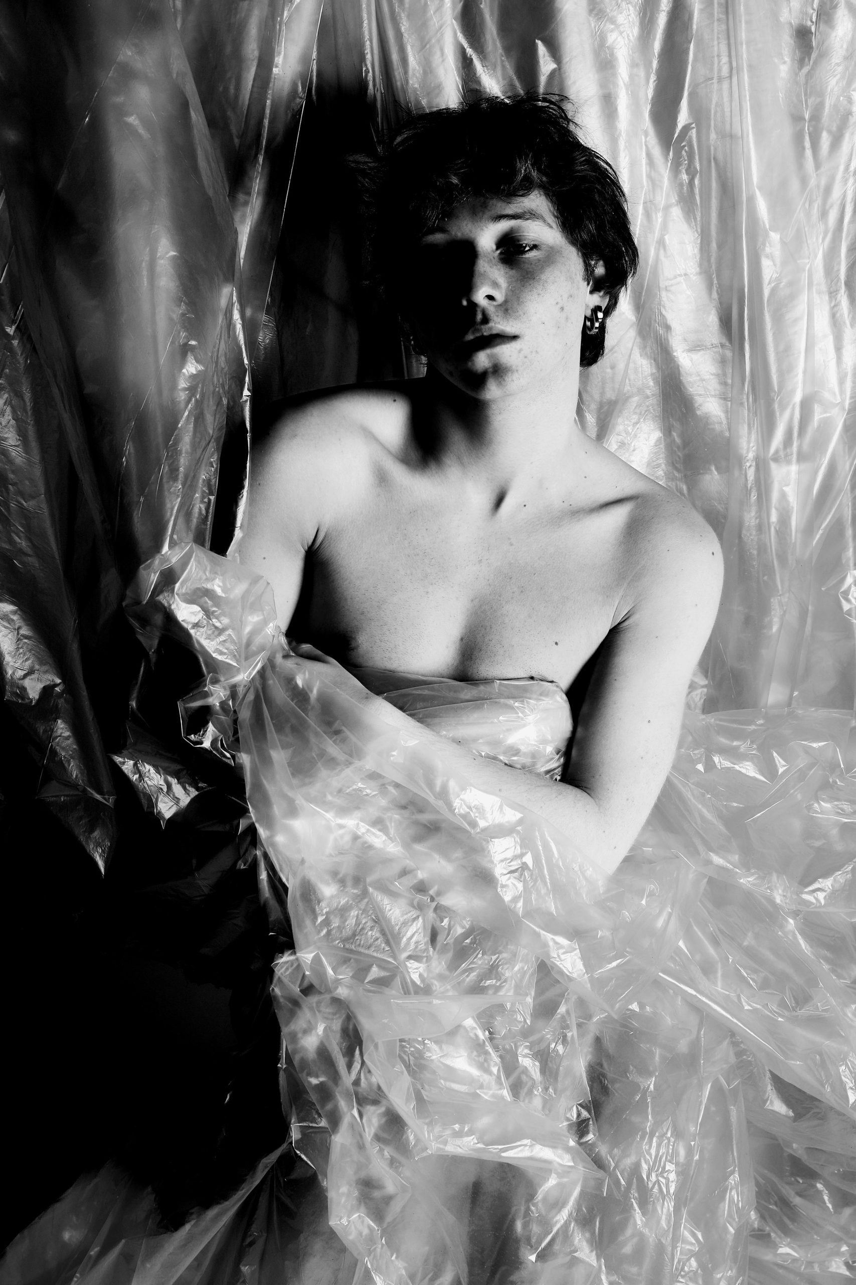 Minimal black and white studio portraits focusing on posture, texture, and the male form against simple backdrops — BLUEBOY, HeyBoy Fanzine